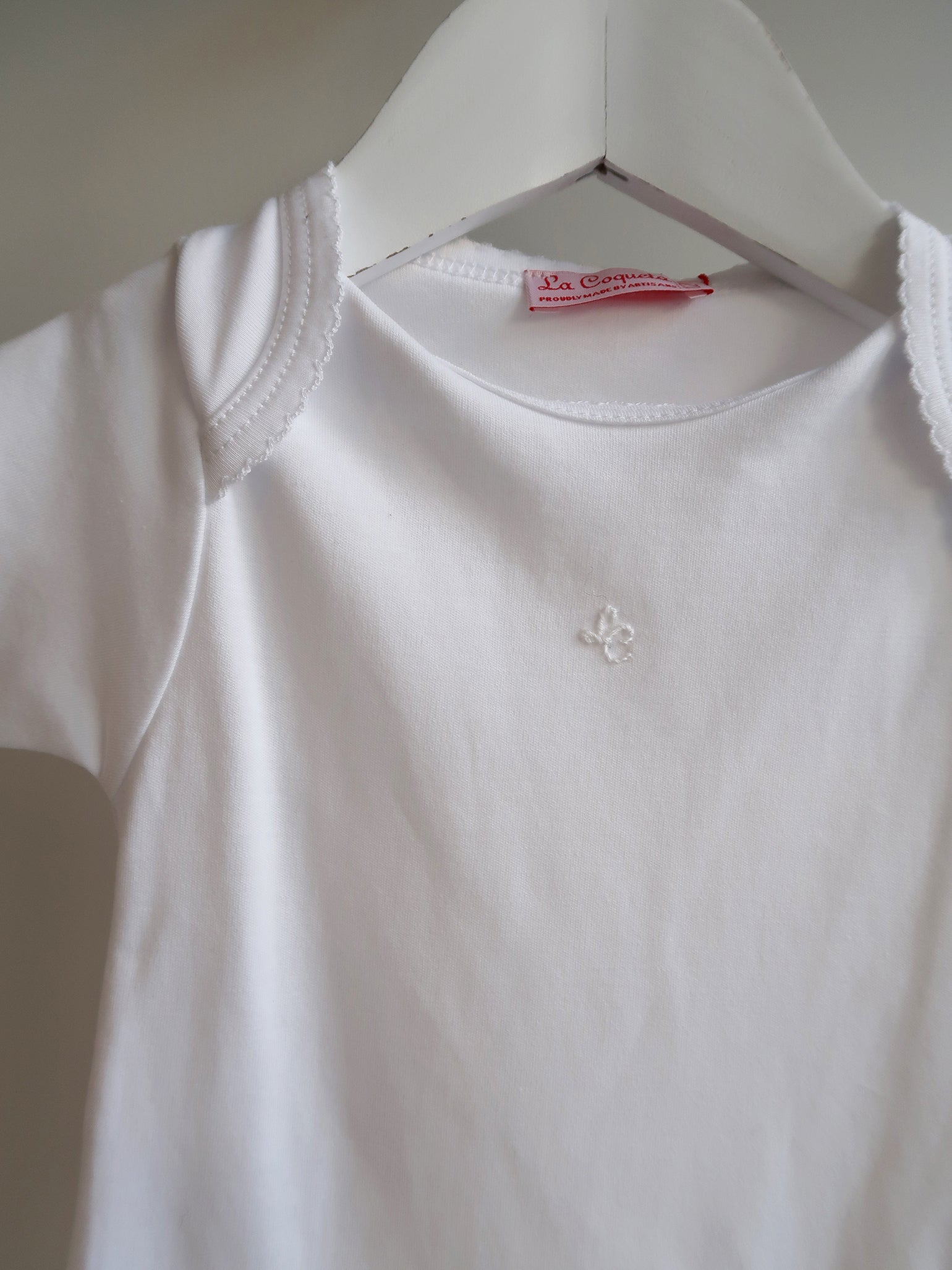 White Lupe Baby Body Vest